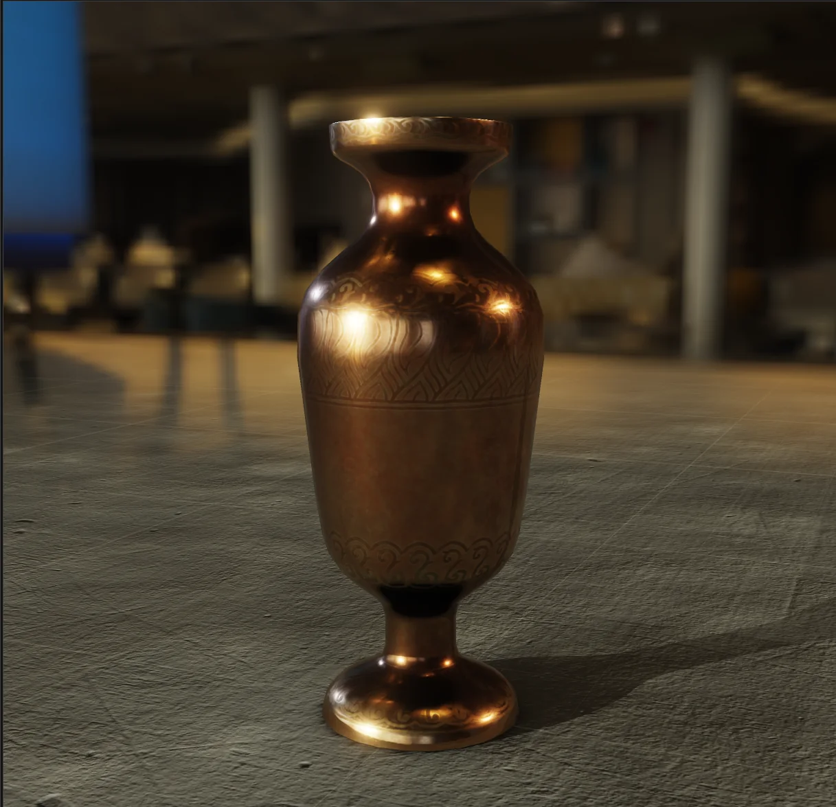 A brass vase on a stone floor, the room behind it visible in the polished metal.