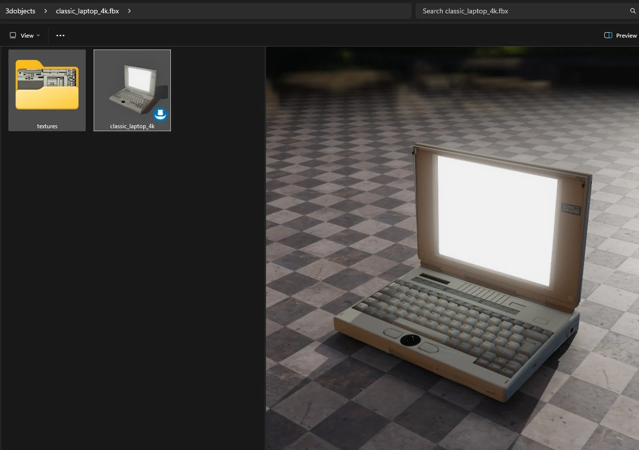 Windows Explorer open on a folder holding one FBX file and its textures. The file's
              tile carries a rendered thumbnail of a 1990s laptop, and the preview pane on the
              right draws the same laptop full size on a checkered marble floor.